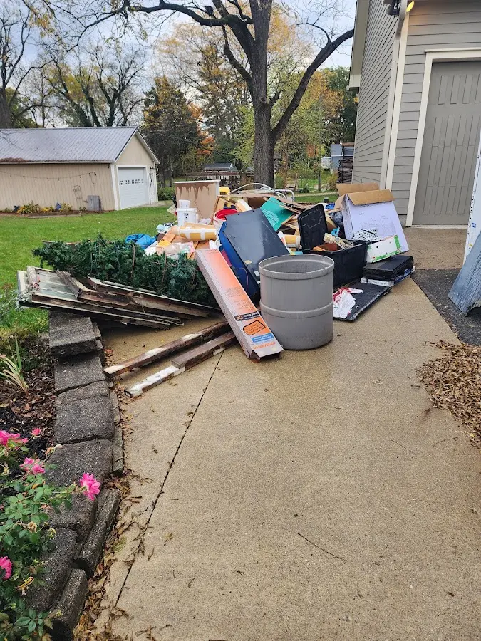 Dumpster being loaded with debris for Commercial Dumpster Rental in Totowa